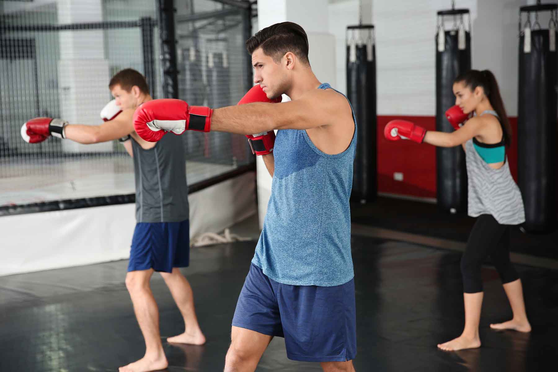 Students in a group class in a boxing gym