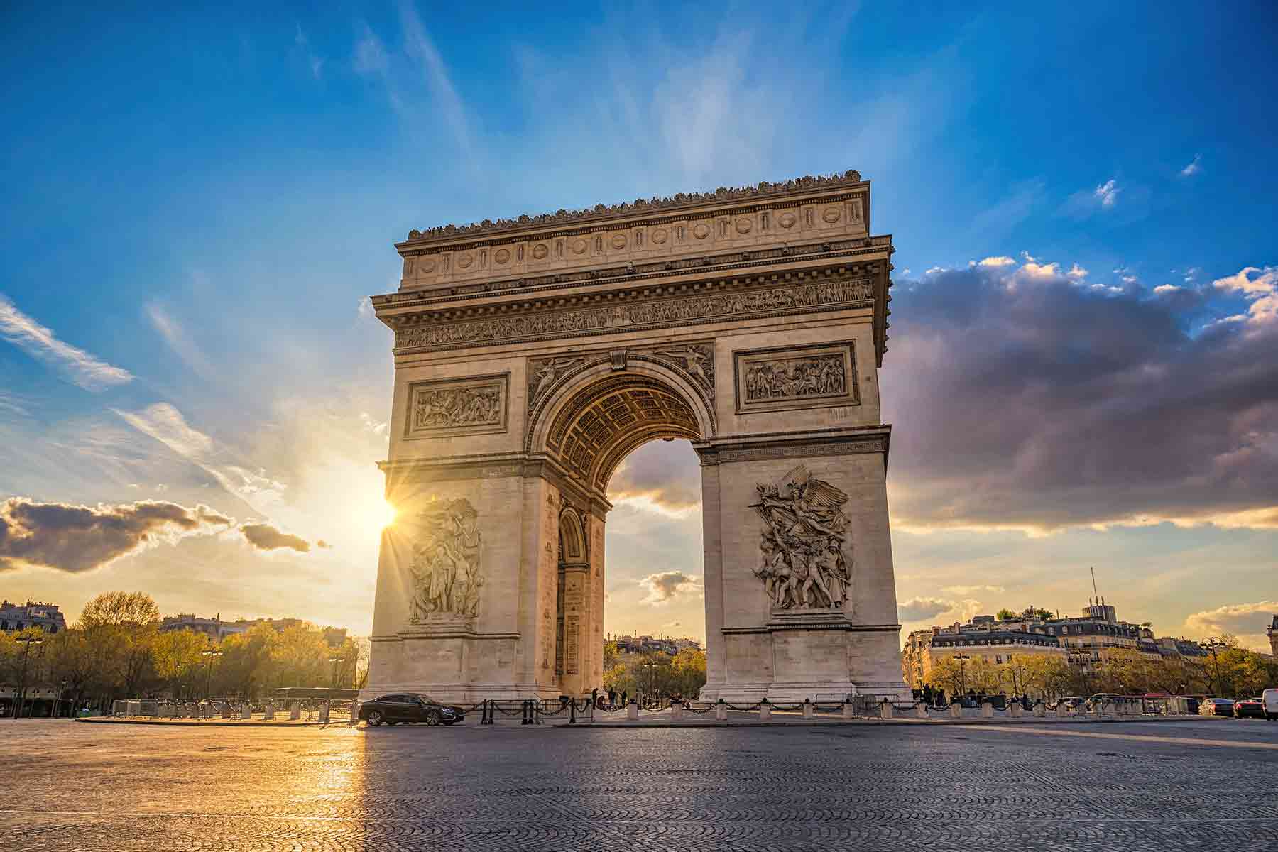 A sunny view of the "Arc de Triomphe" in the Etoile - Charles De Gaule square in Paris