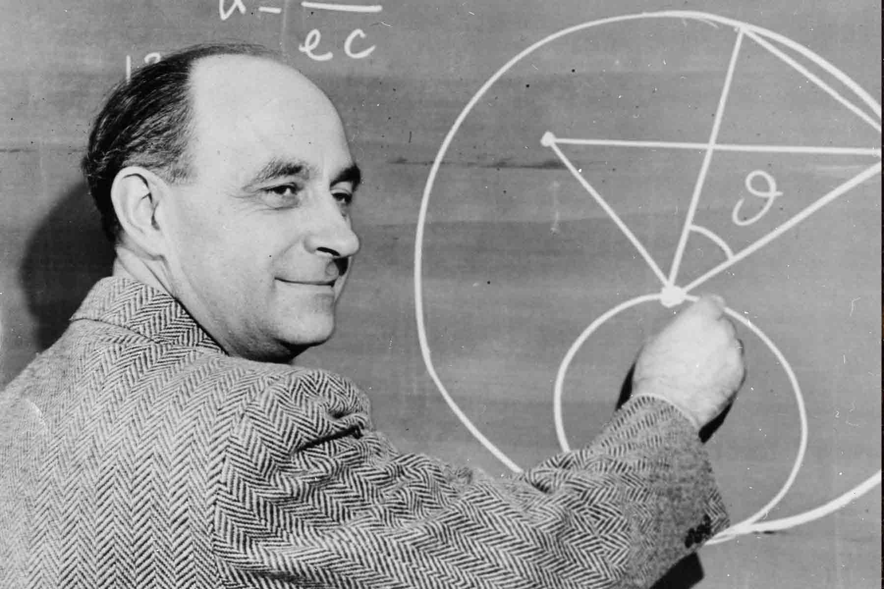 Enrico Fermi writing equations at the blackboard