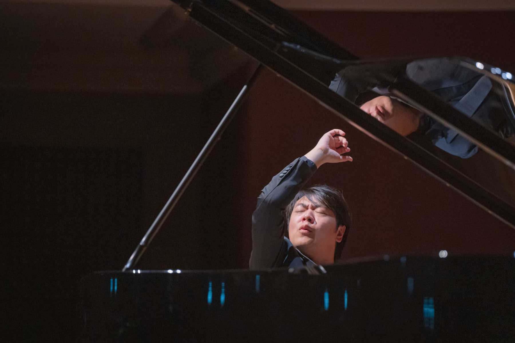 Lang Lang playing at a concert in Basel, Switzerland (Photo credit: Wikimedia Commons/FotomanBasel)