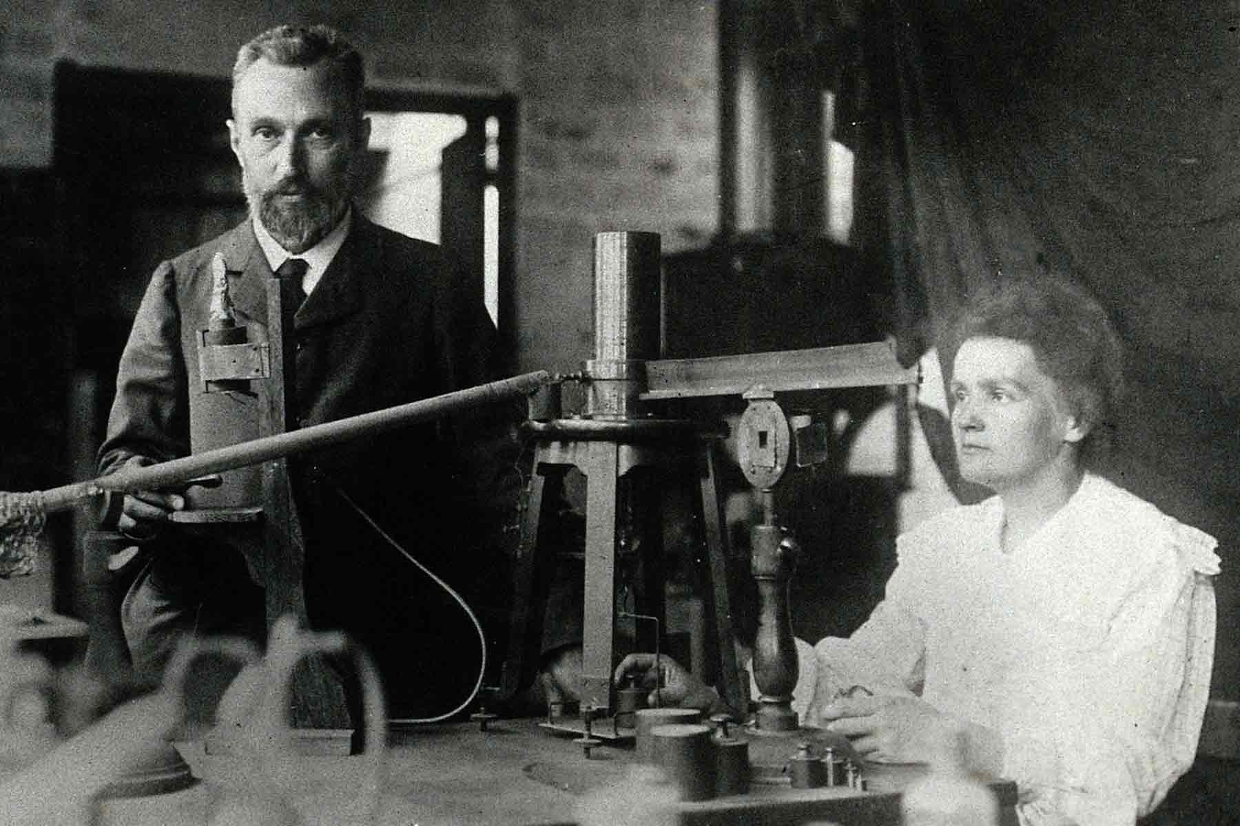 Marie Curie and her husband Pierre doing an experiment in the laboratory (Photo credit: Wikimedia Commons)